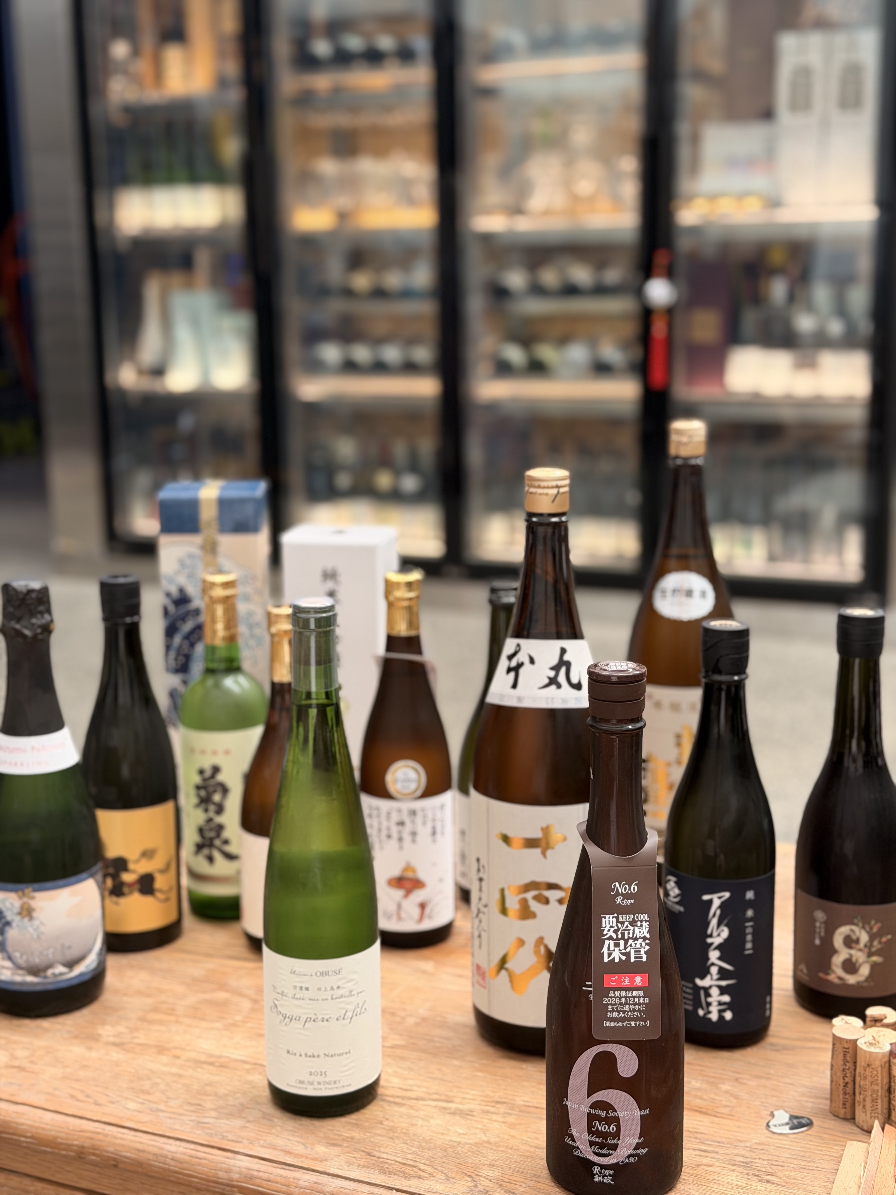 SakeMeta’s Japanese sake and hojicha umeshu selection, with ARAMASA No.6 R-Type in the foreground